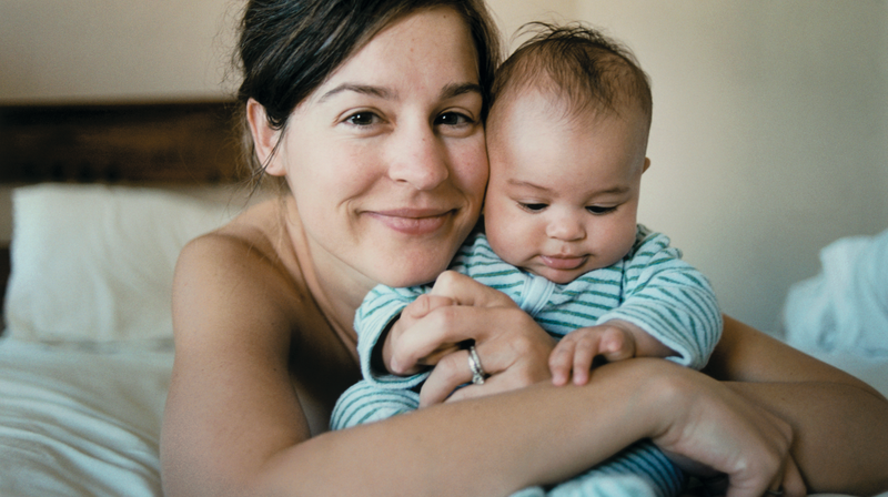 Mother holding cute baby 