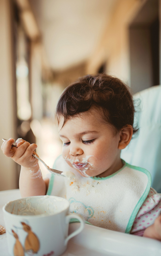 cute baby eating cereal 