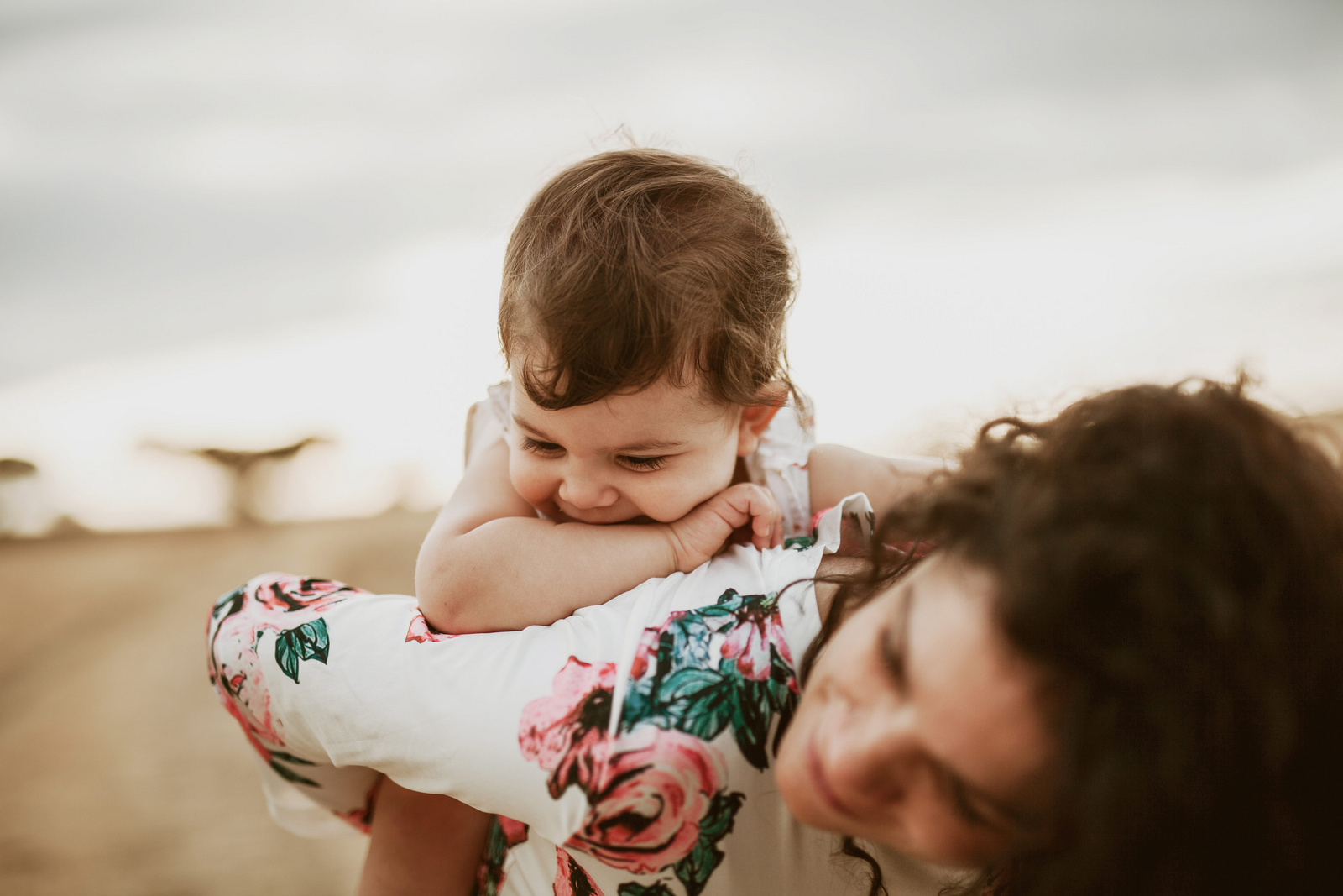 happy baby riding on mom's back